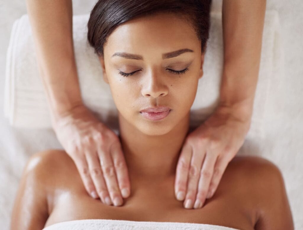 Edinburgh holistic therapist performing shoulder massage treatment